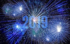 “2019” written in the sky surrounded by blue fireworks