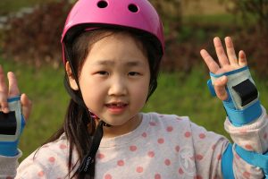 Closeup of young child in helmet on skates