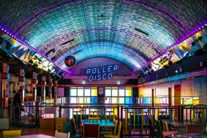 Roller disco neon sign with disco ball