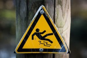 Yellow hazard sign of person falling down